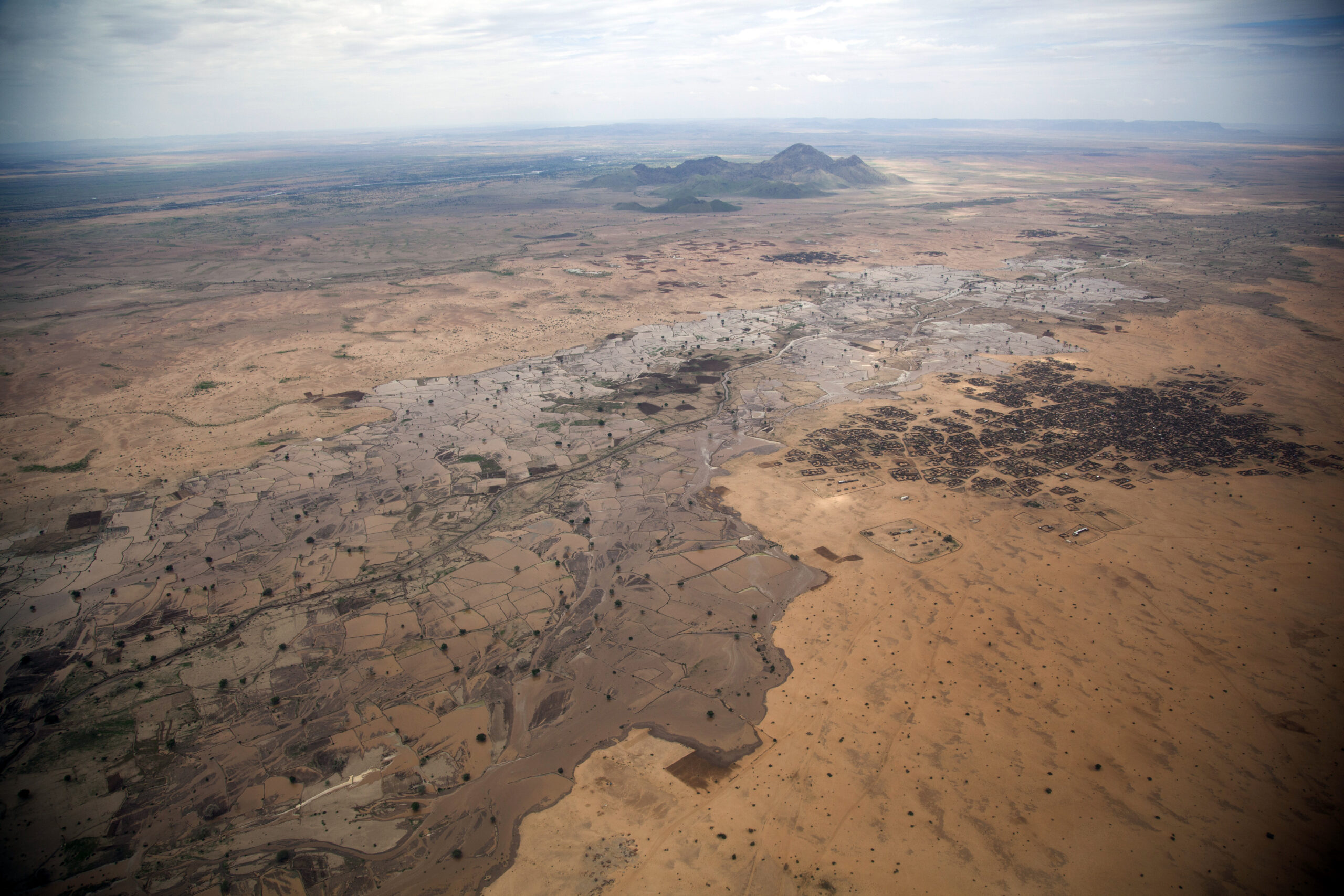 View over Dali, North Darfur An aerial view over Dali, near Tawila in North Darfur, Sudan. In early 2011, a community fleeing heavy fighting in their native Shangil Tobaya set up camp in Dali. Photo ID 482451. 16/08/2011. Tawila, Sudan. UN Photo/Albert Gonzalez Farran. www.unmultimedia.org/photo/