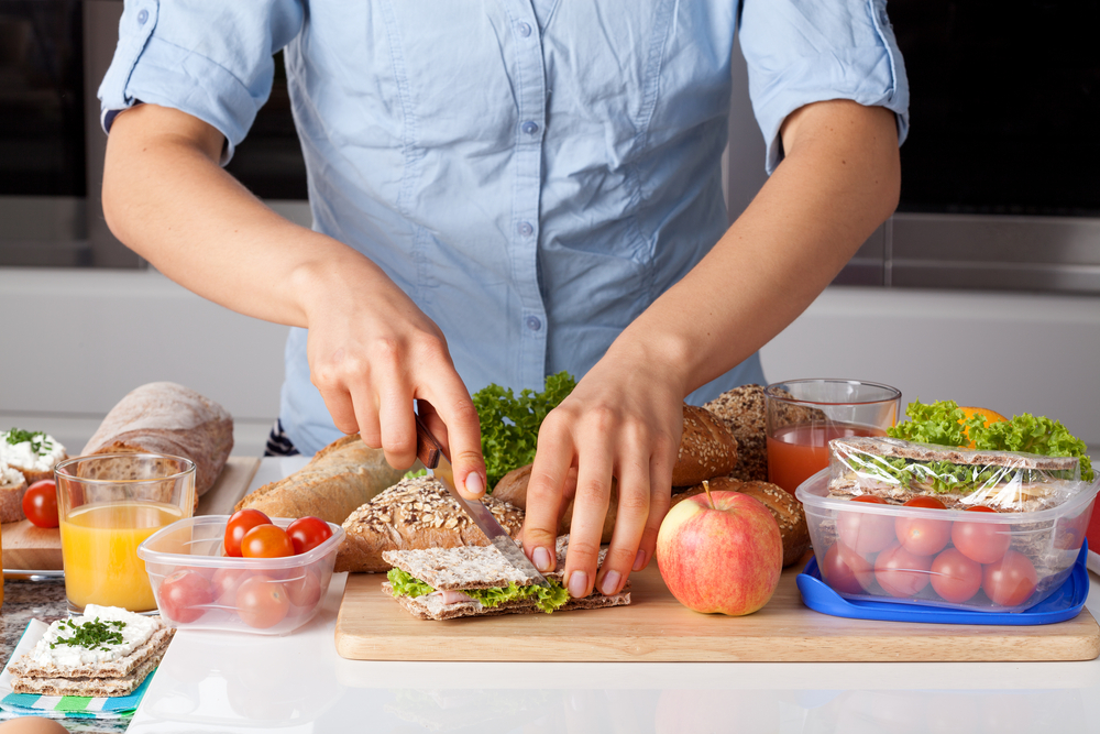 A person making a healthy sandwich