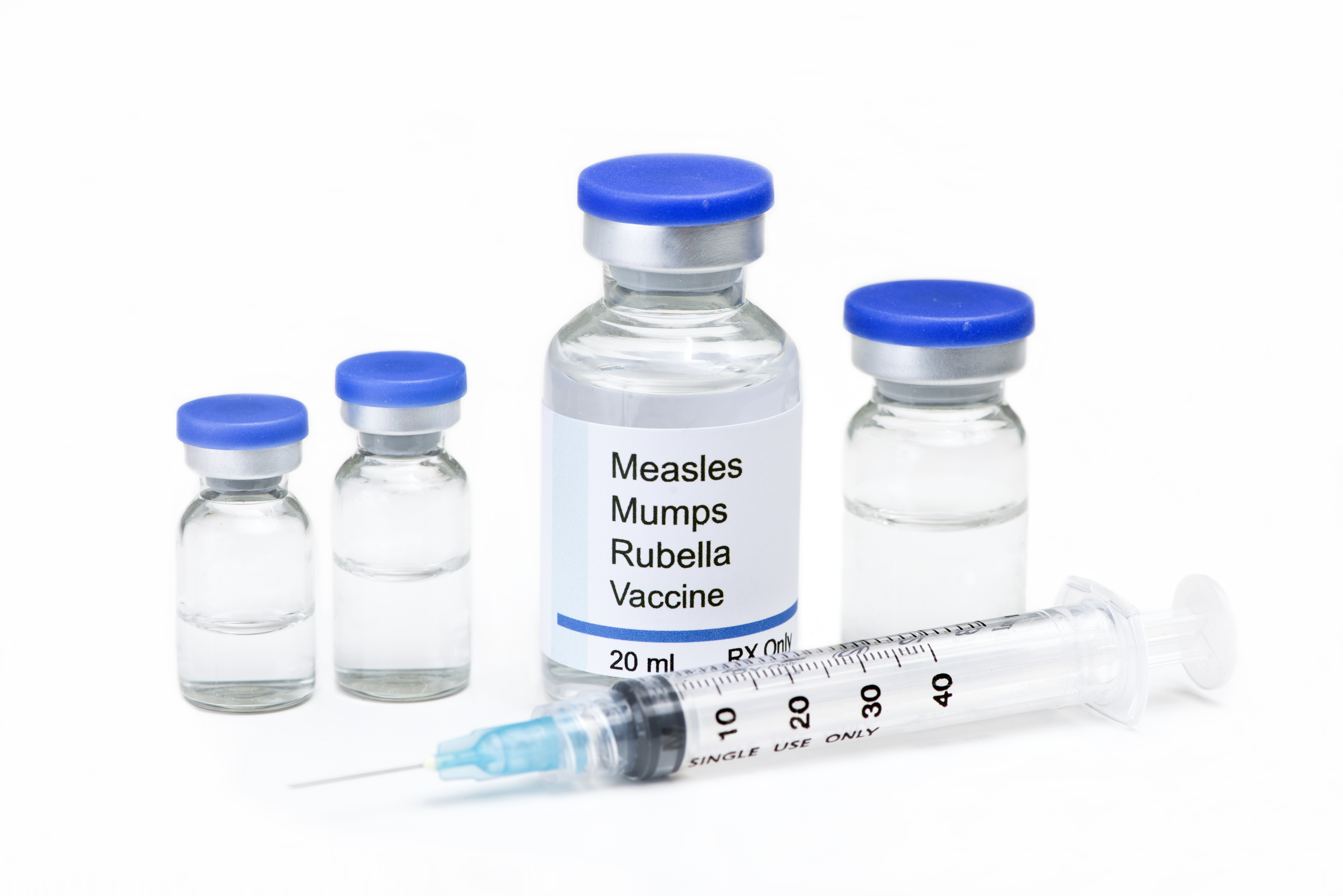 Measles, mumps, rubella, virus vaccine vials and syringe on white background