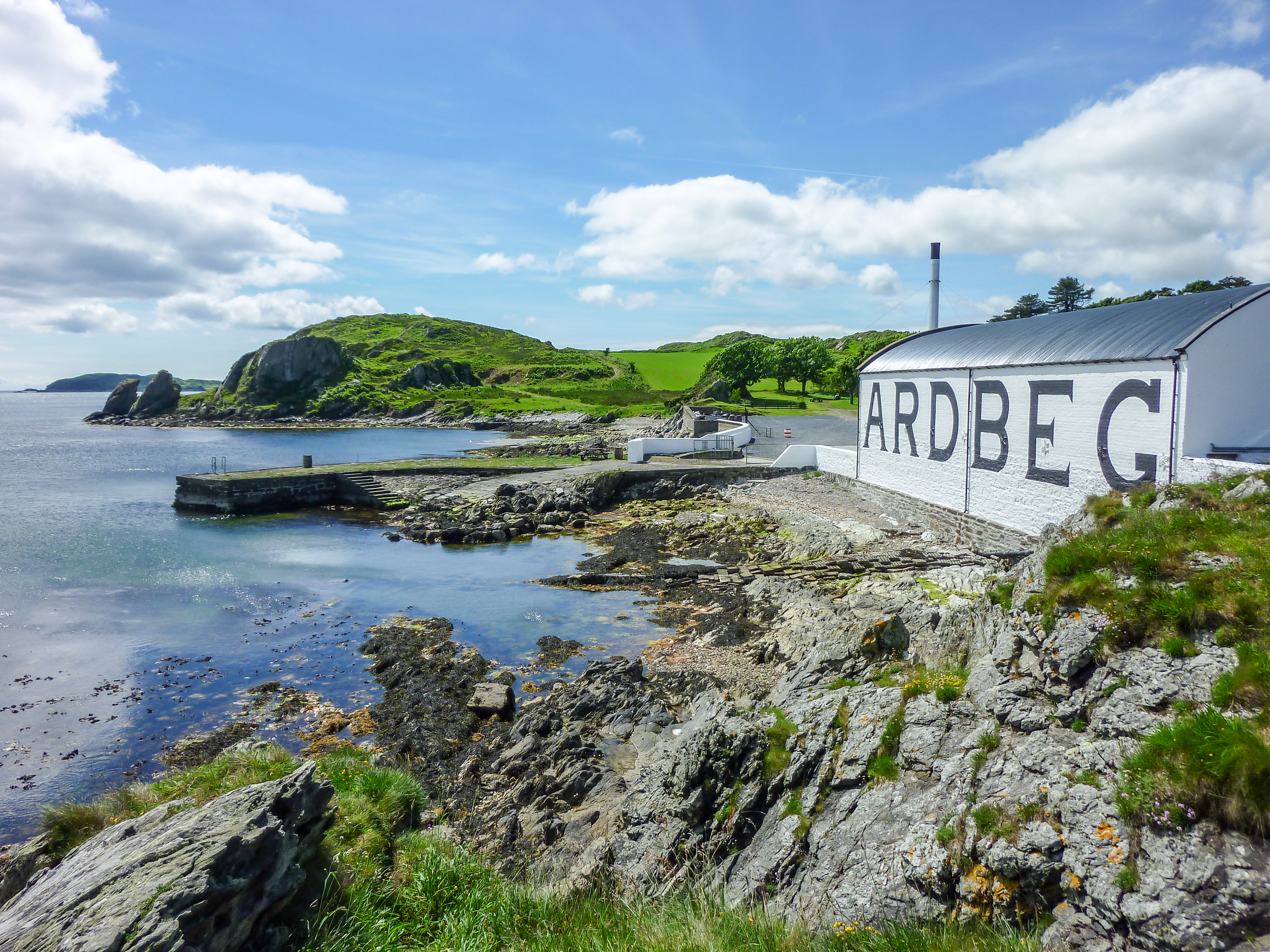 The sun shines on Ardbeg distillery warehouse